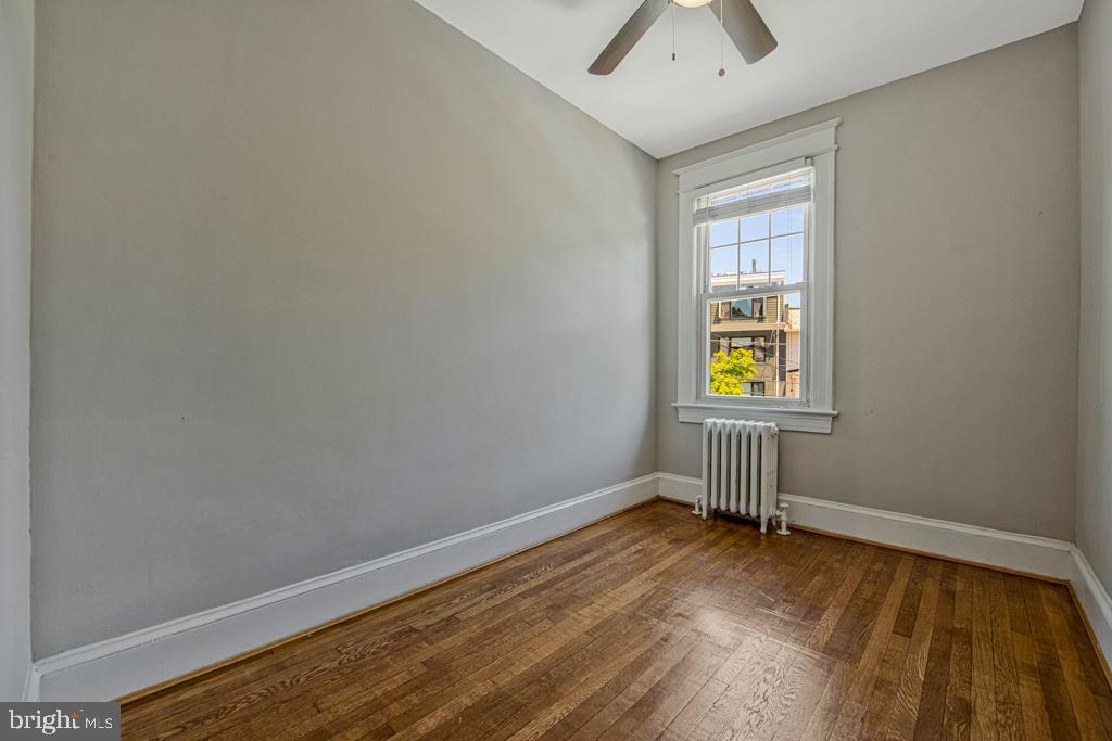 2406 37th Street Northwest Washington, DC 20007 - Photo 39 of 44 a view of an empty room and a window