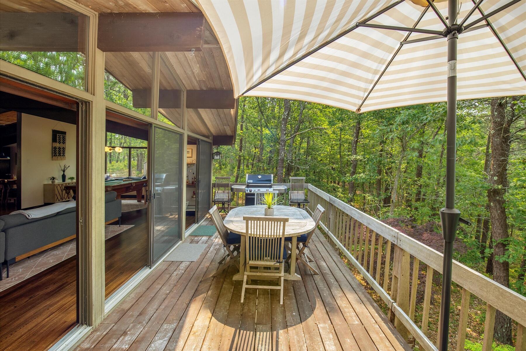 80 Woodlot Road Wellfleet, MA 02667 - Photo 13 of 67 a view of a chairs and table in the balcony