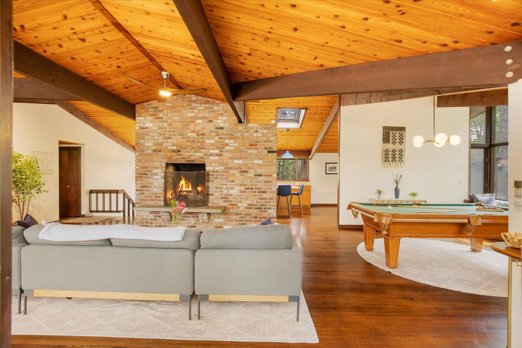 80 Woodlot Road Wellfleet, MA 02667 - Photo 15 of 67 a living room with fireplace furniture and a wooden floor