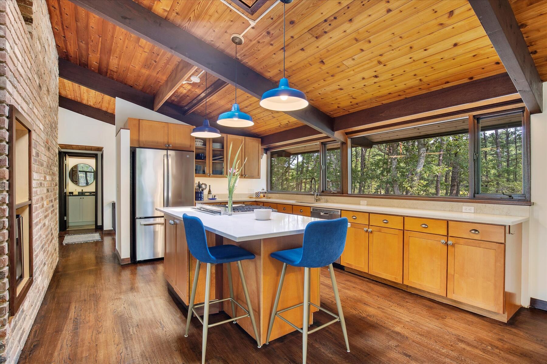 80 Woodlot Road Wellfleet, MA 02667 - Photo 20 of 67 a dining table with chairs and wooden floor