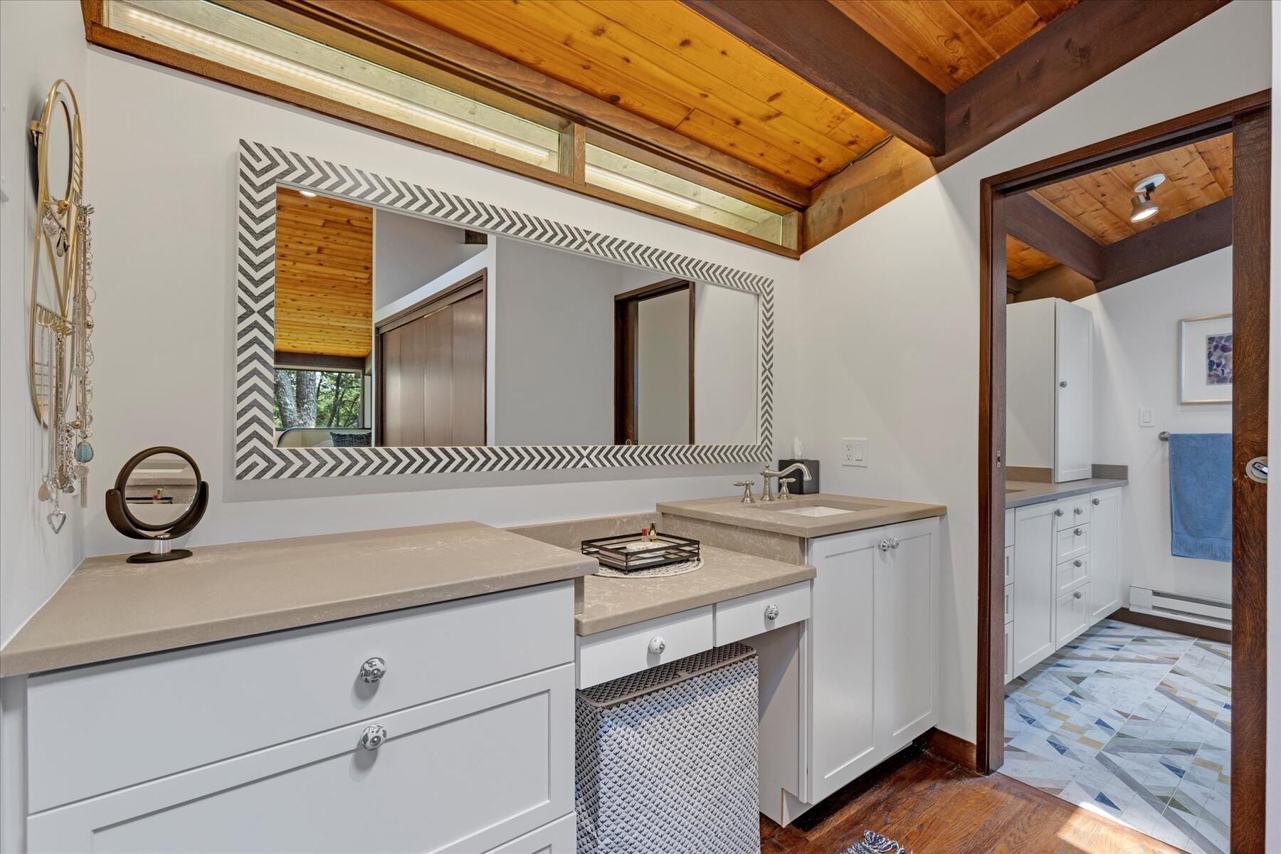 80 Woodlot Road Wellfleet, MA 02667 - Photo 28 of 67 a bathroom with a sink and a mirror