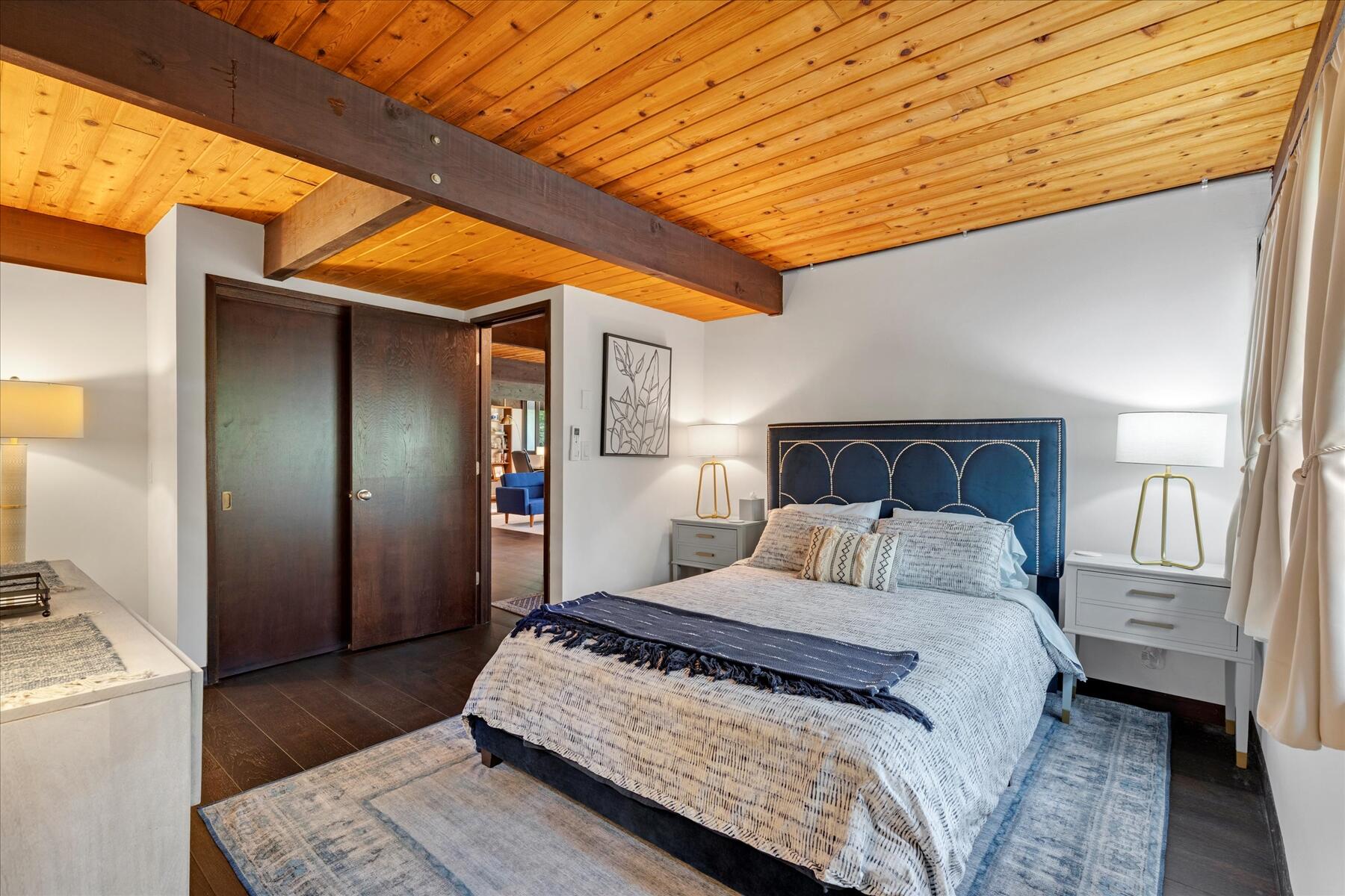 80 Woodlot Road Wellfleet, MA 02667 - Photo 32 of 67 a bedroom with a bed and a mirror