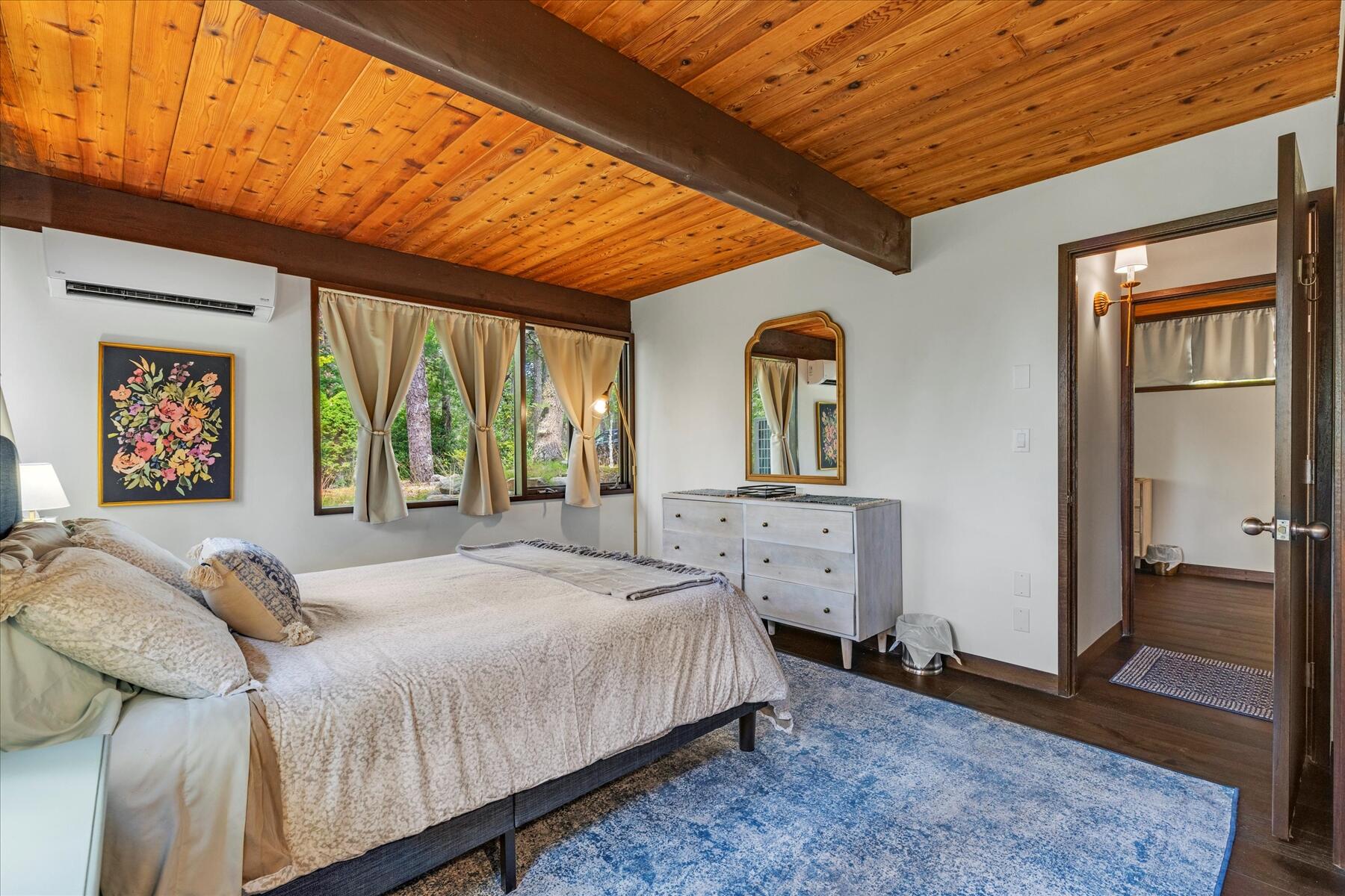 80 Woodlot Road Wellfleet, MA 02667 - Photo 34 of 67 a bedroom with a bed and a large window