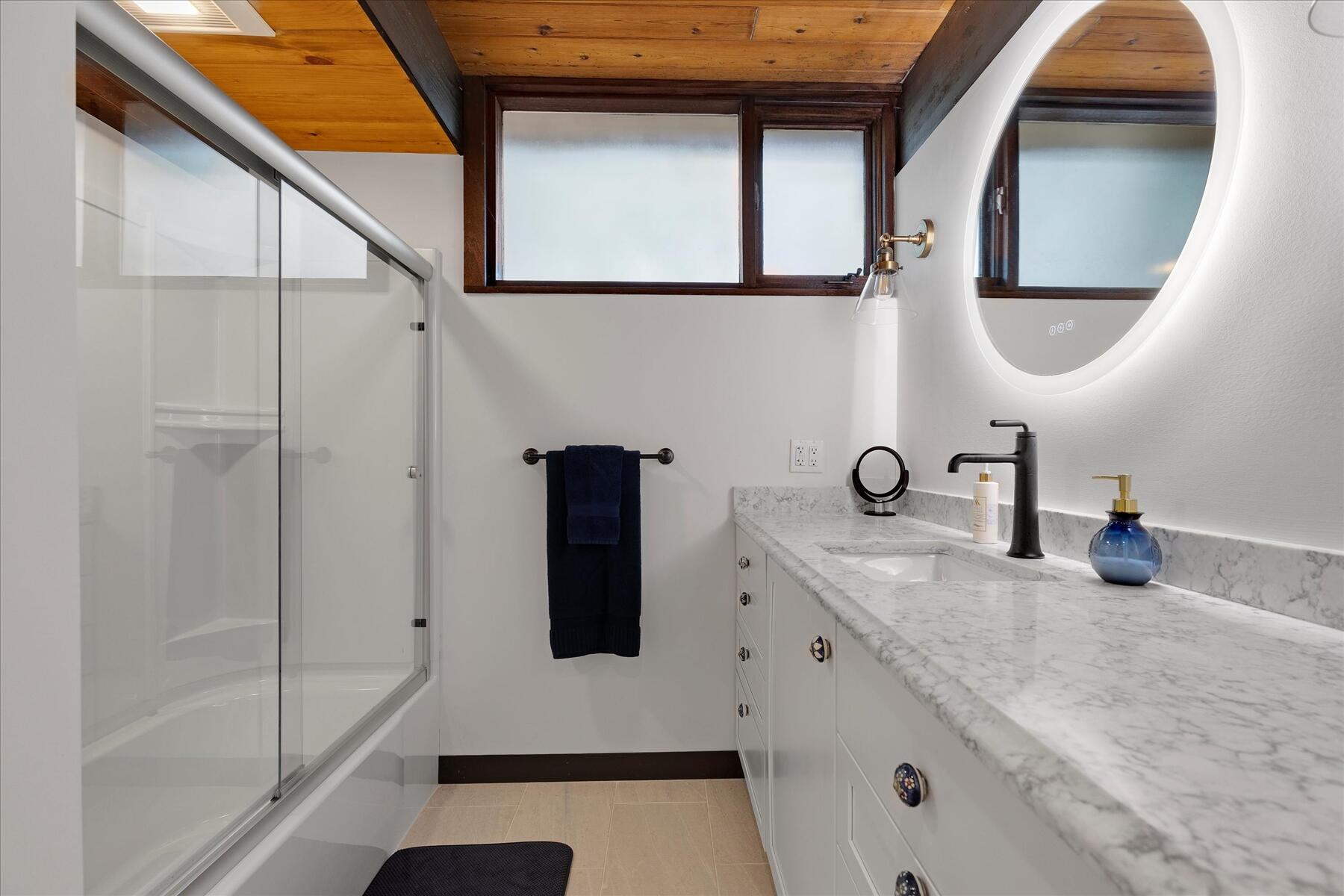 80 Woodlot Road Wellfleet, MA 02667 - Photo 37 of 67 a bathroom with a double vanity sink and a mirror