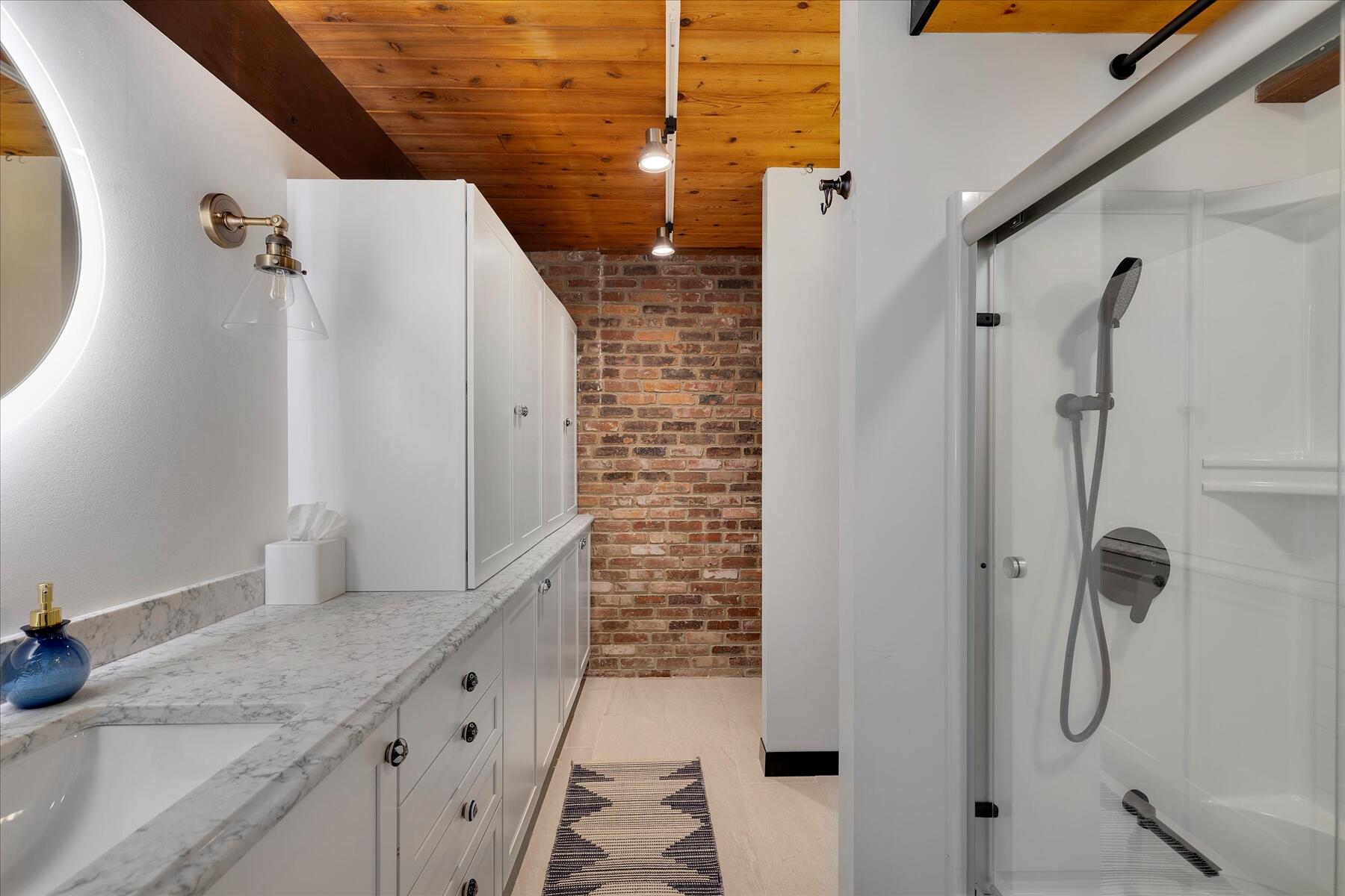 80 Woodlot Road Wellfleet, MA 02667 - Photo 38 of 67 a bathroom with a granite countertop shower and a sink