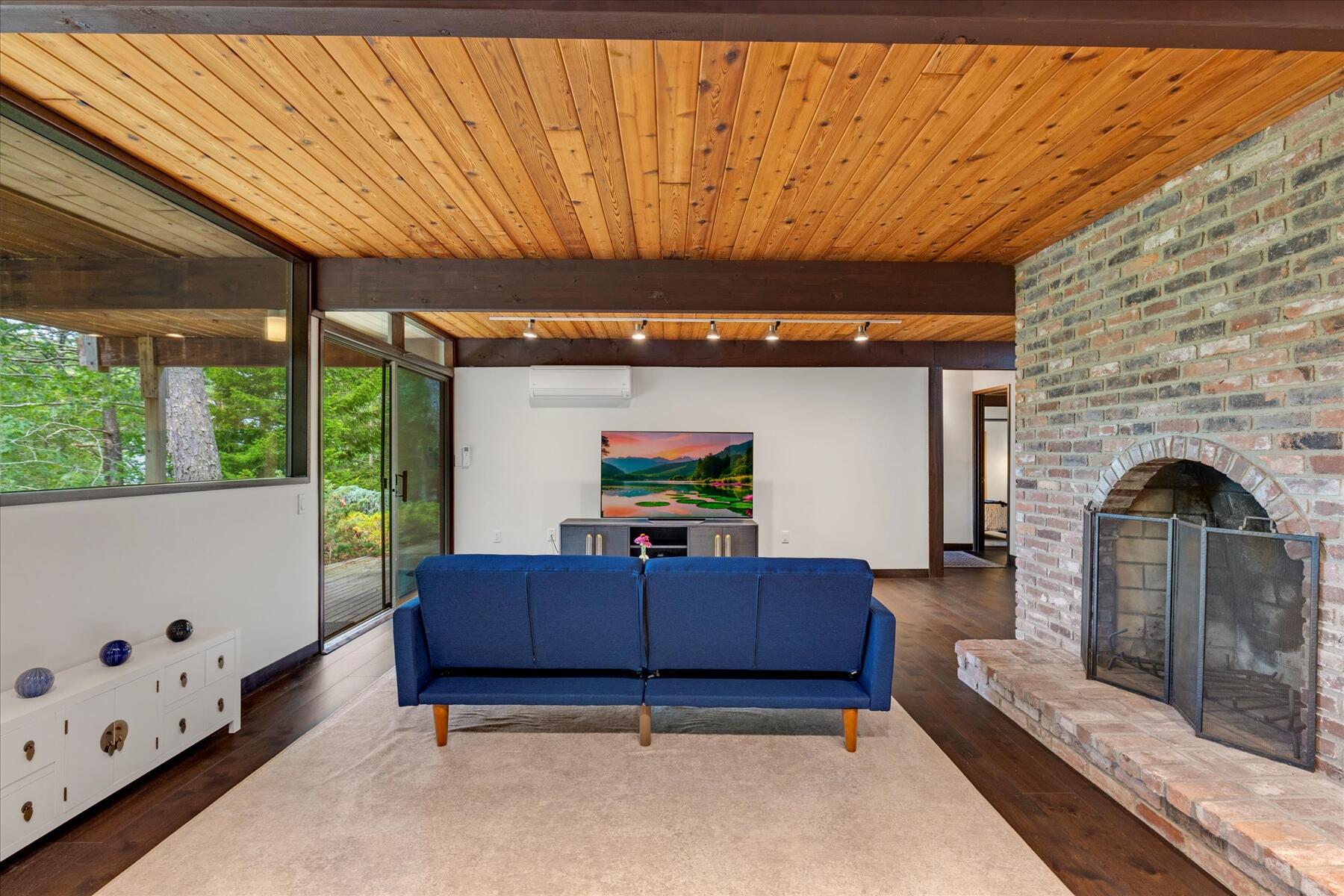 80 Woodlot Road Wellfleet, MA 02667 - Photo 40 of 67 a living room with furniture and a flat screen tv