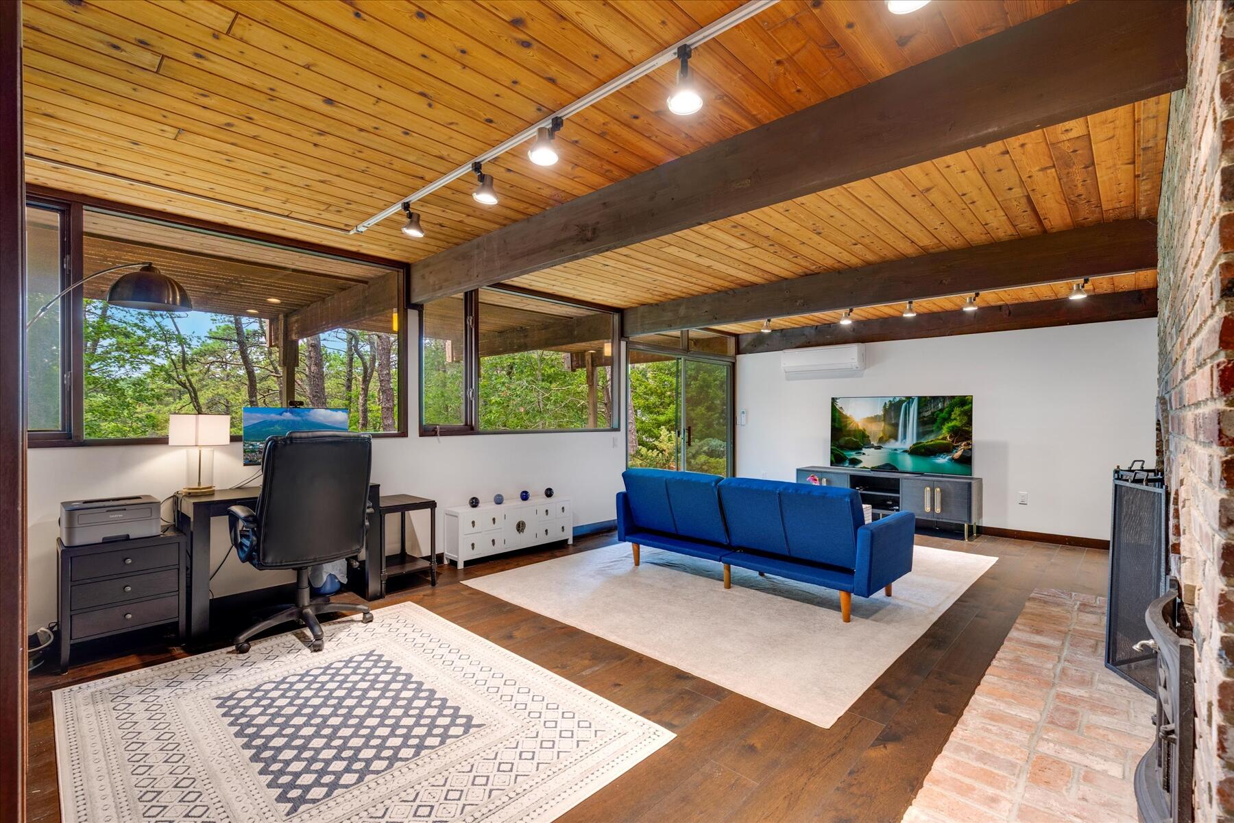 80 Woodlot Road Wellfleet, MA 02667 - Photo 42 of 67 a living room with furniture and a large window