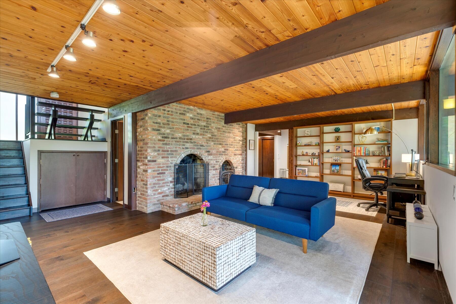 80 Woodlot Road Wellfleet, MA 02667 - Photo 43 of 67 a living room with furniture and a fireplace