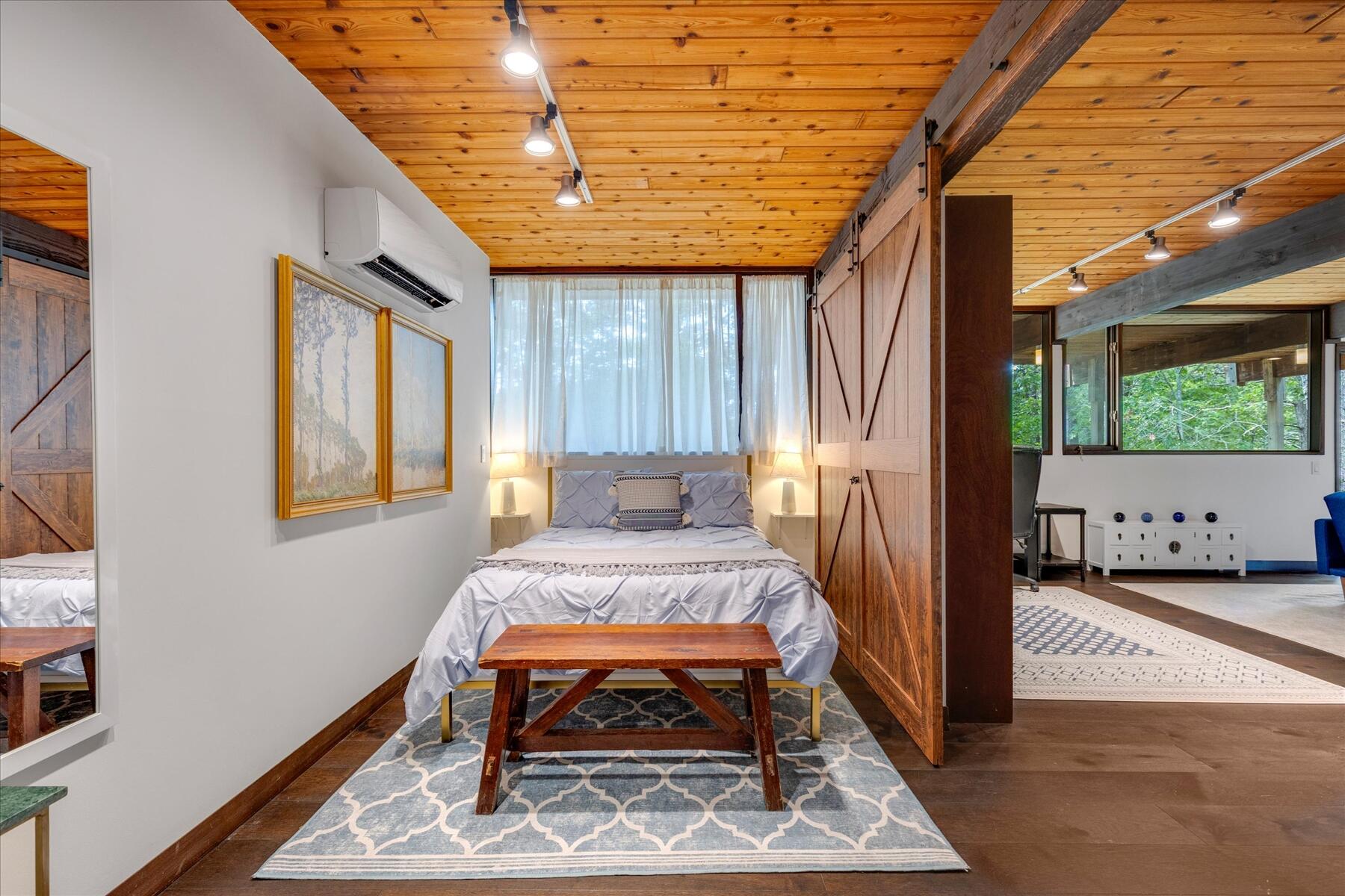 80 Woodlot Road Wellfleet, MA 02667 - Photo 44 of 67 a bed room with a bed and a window