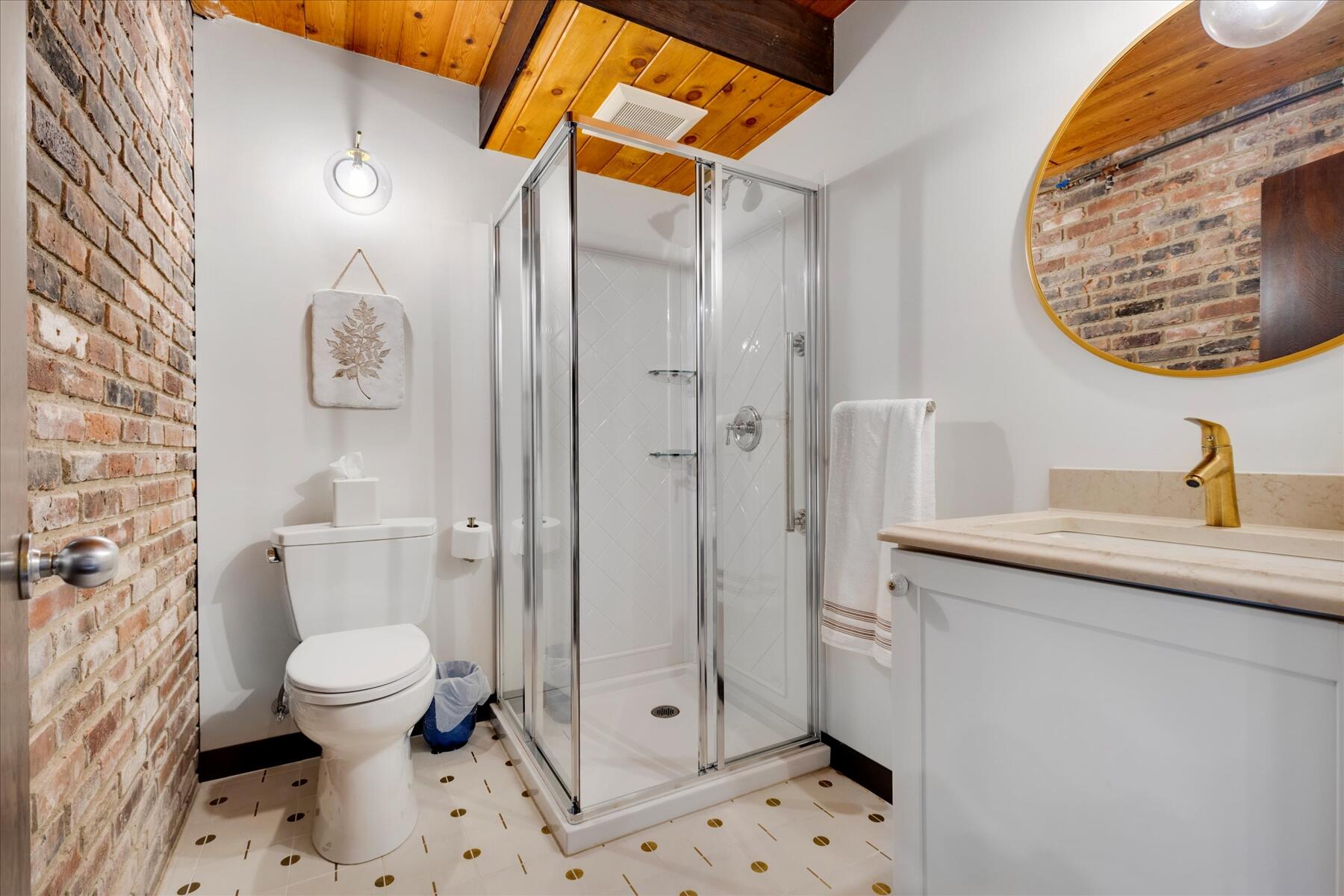 80 Woodlot Road Wellfleet, MA 02667 - Photo 46 of 67 a bathroom with a sink a toilet and a mirror