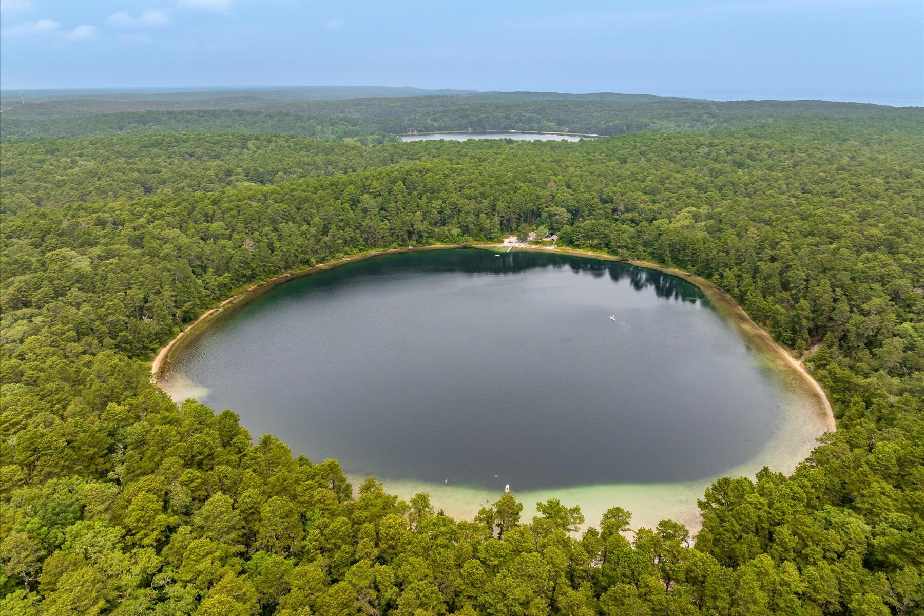 80 Woodlot Road Wellfleet, MA 02667 - Photo 52 of 67 a view of a lake with a yard