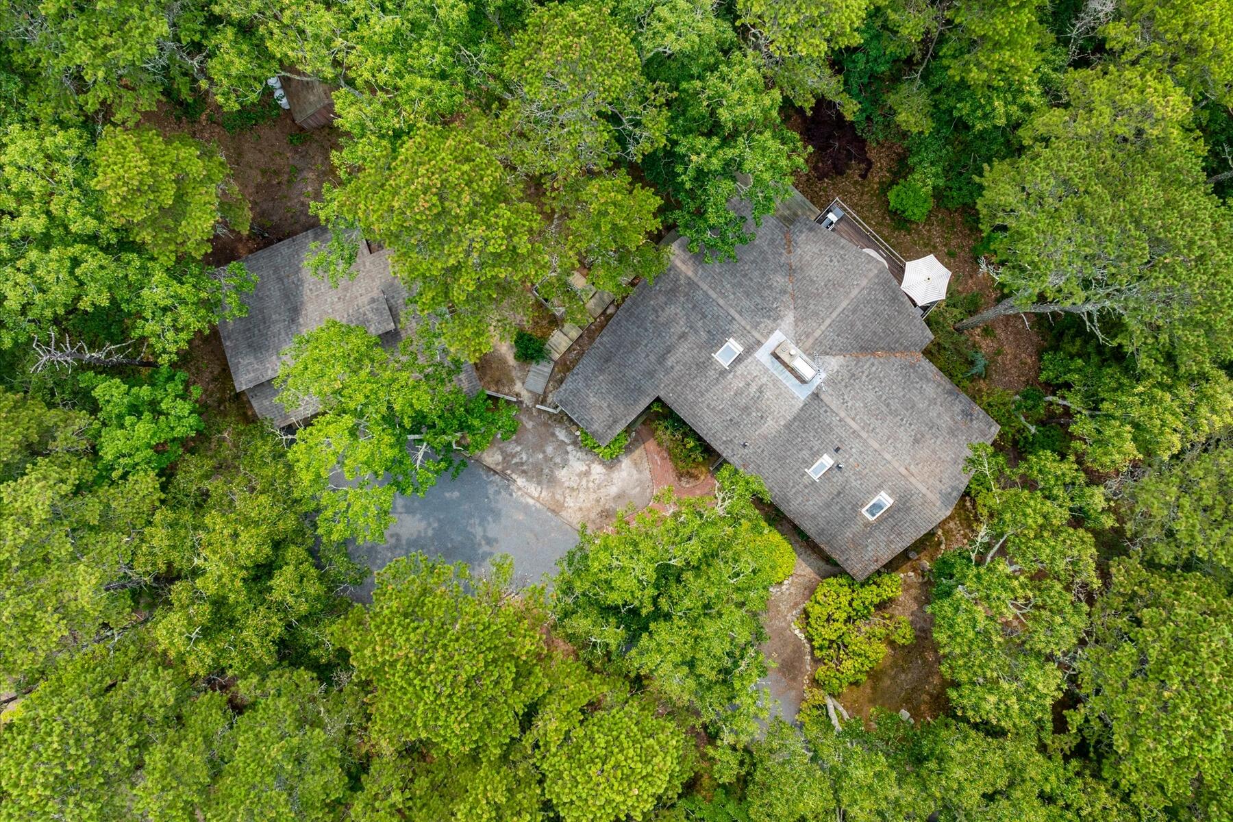 80 Woodlot Road Wellfleet, MA 02667 - Photo 56 of 67 an aerial view of a house with a yard