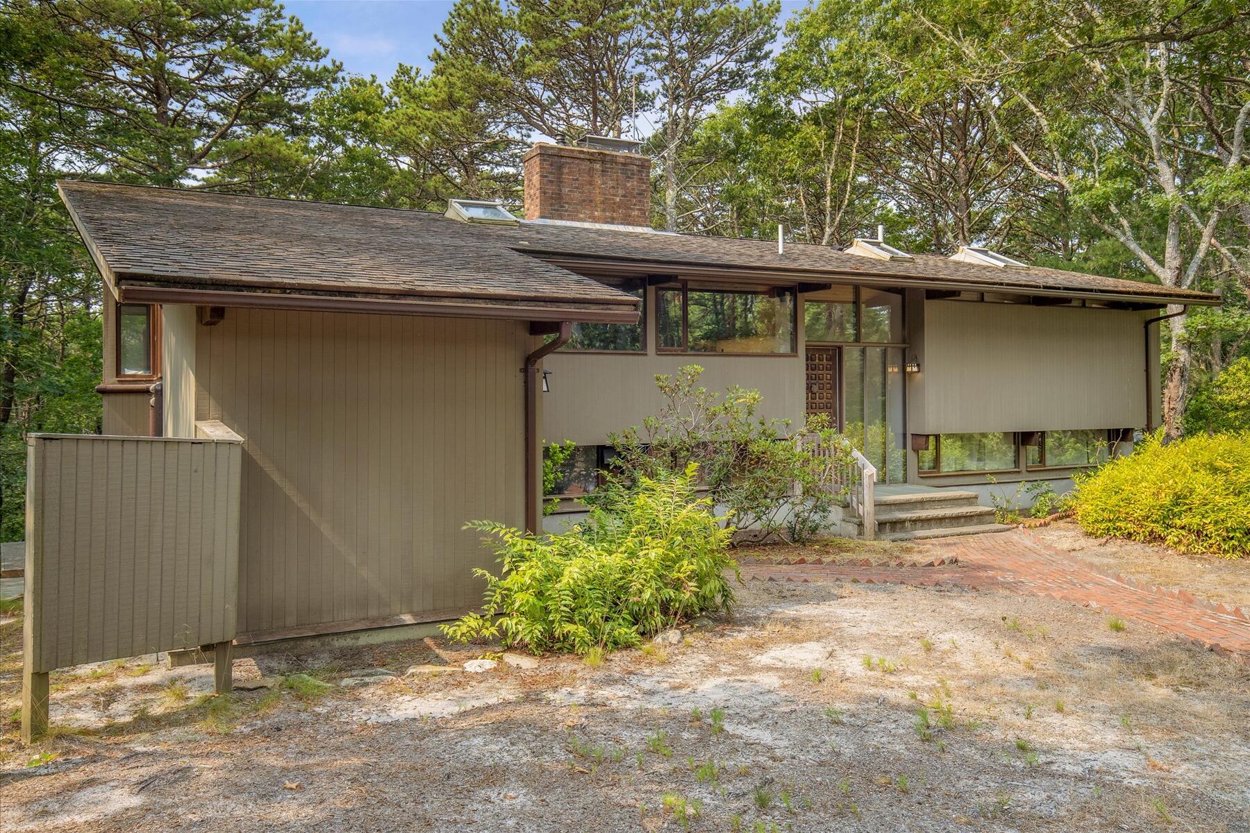 80 Woodlot Road Wellfleet, MA 02667 - Photo 59 of 67 a front view of a house with garden
