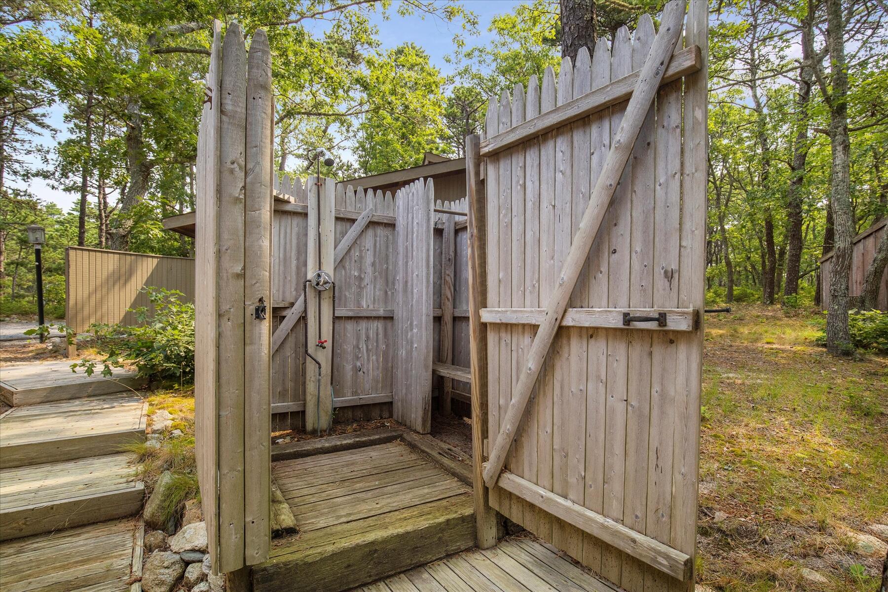 80 Woodlot Road Wellfleet, MA 02667 - Photo 62 of 67 a view of a balcony with wooden floor and wooden fence