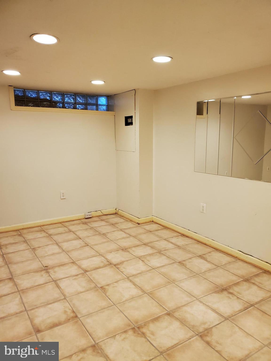 7859 Rockbourne Road Dundalk, MD 21222 - Photo 16 of 24 Lower playroom,Office, Exercise Area, Man Cave