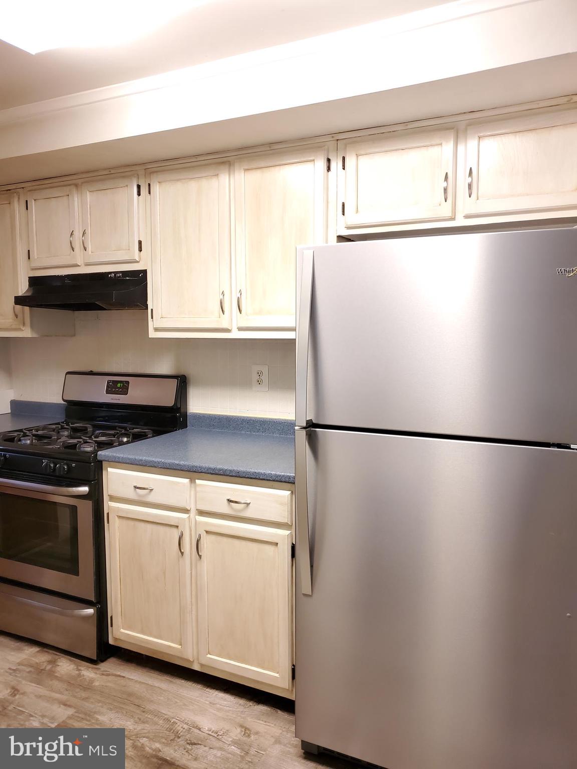 7859 Rockbourne Road Dundalk, MD 21222 - Photo 8 of 24 Kitchen. Freshly painted cabinets (last week).