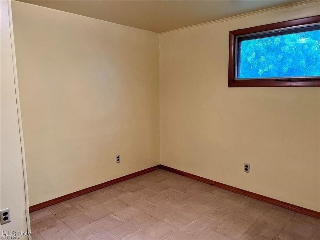 8581 Fair Road Strongsville, OH 44149 - Photo 11 of 20 Empty room featuring baseboards and light flooring