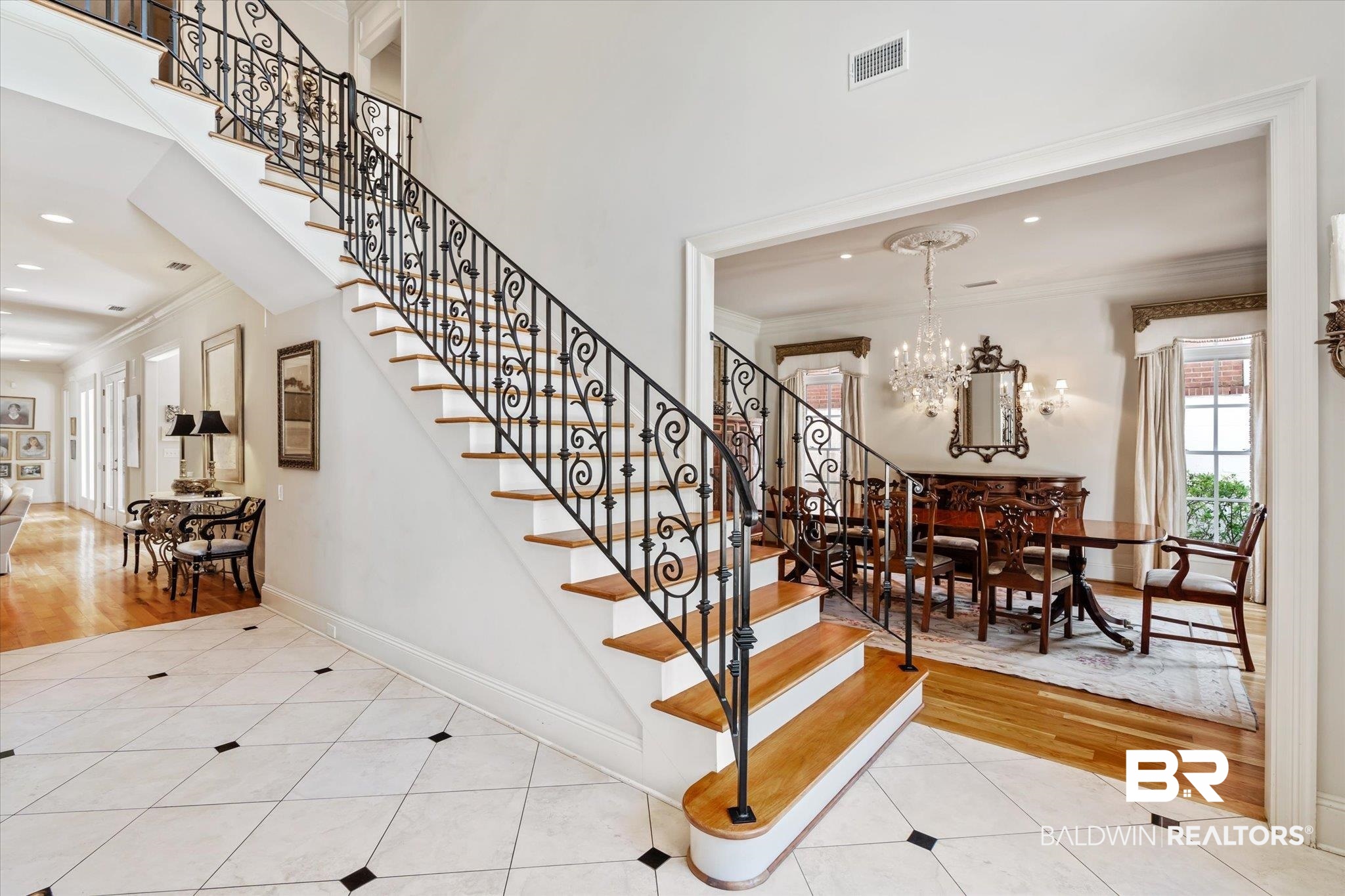 3963 Wimbledon Park Mobile, AL 36608 - Photo 3 of 51 Stairs featuring ornamental molding, hardwood / wood-style floors, and an inviting chandelier