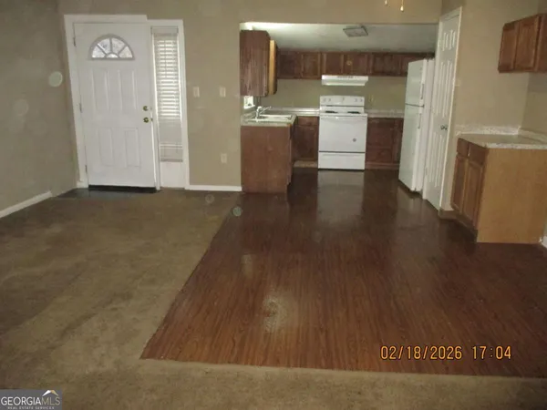 a bathroom with a toilet and a bathtub
