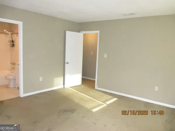 a bathroom with a shower a toilet and sink
