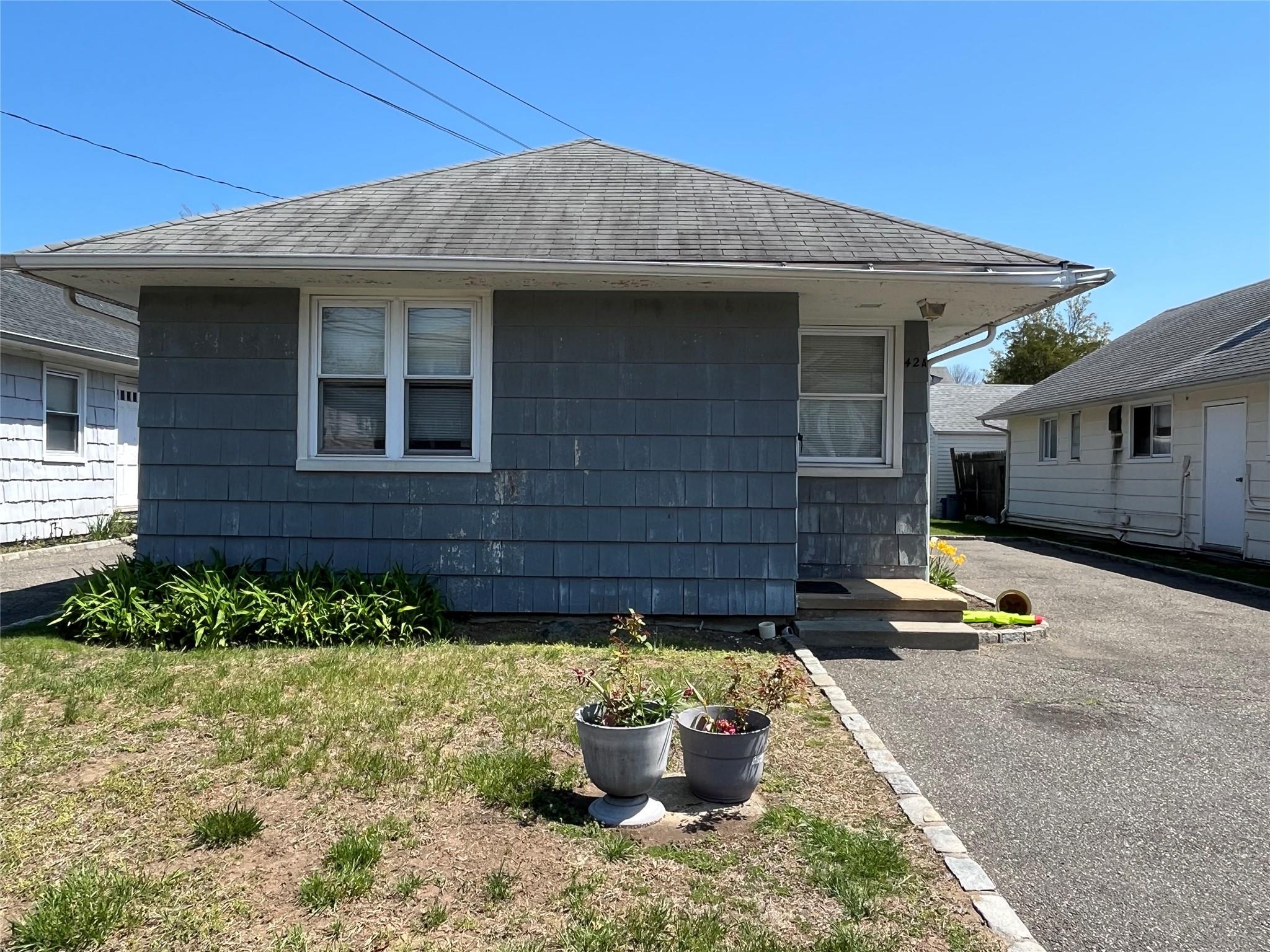 a front view of a house with patio