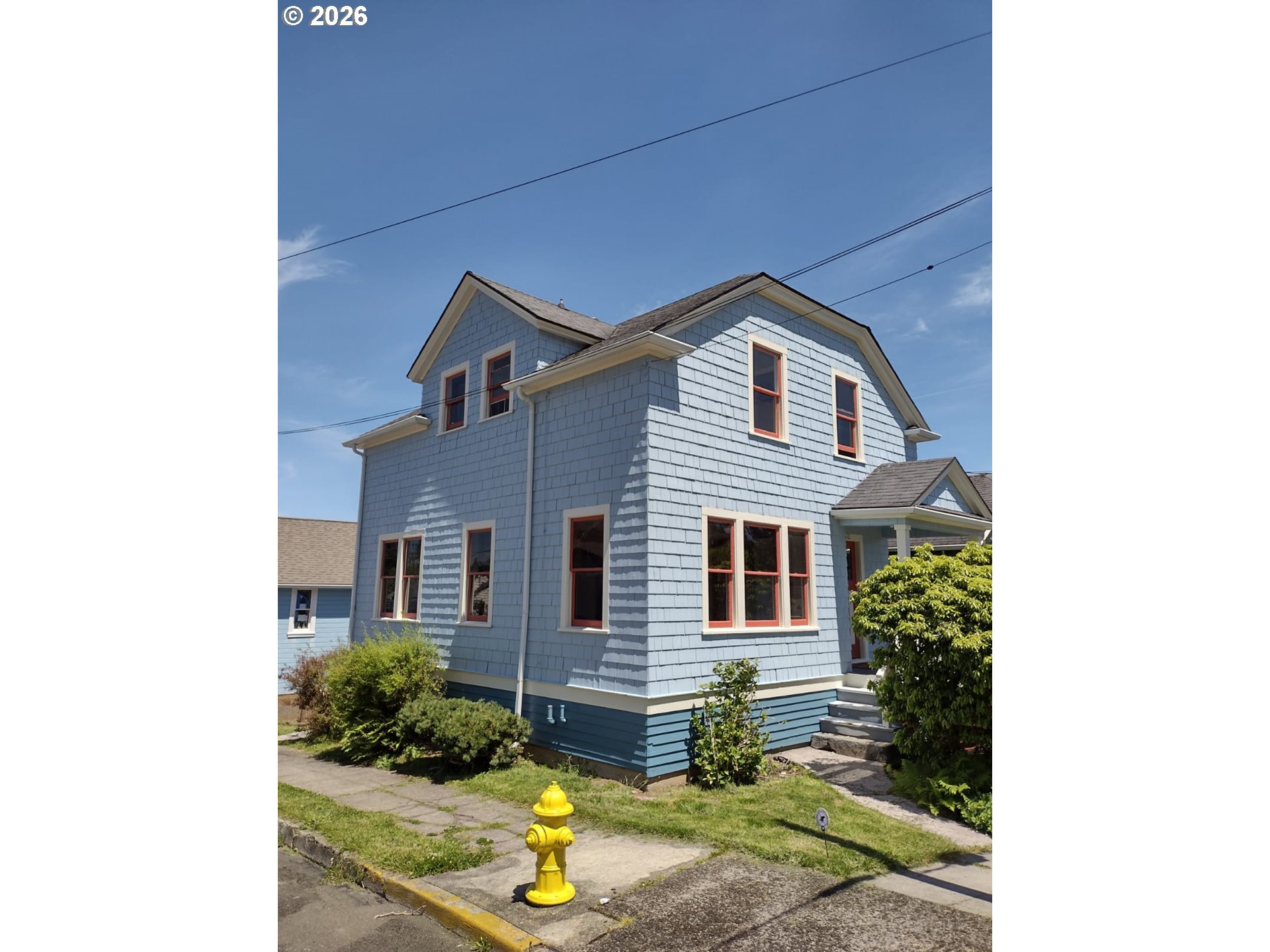 612 Harrison Avenue Astoria, OR 97103 - Photo 1 of 17 a front view of a house with a yard