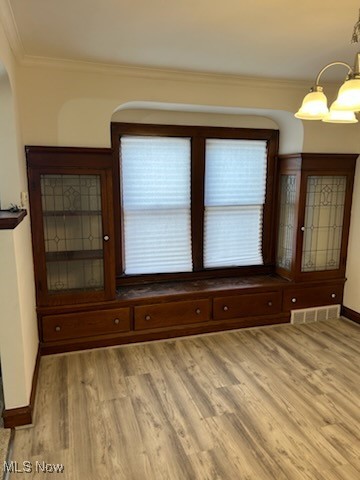 11509 Granger Road Cleveland, OH 44125 - Photo 6 of 16 Unfurnished room with crown molding and light wood-style flooring