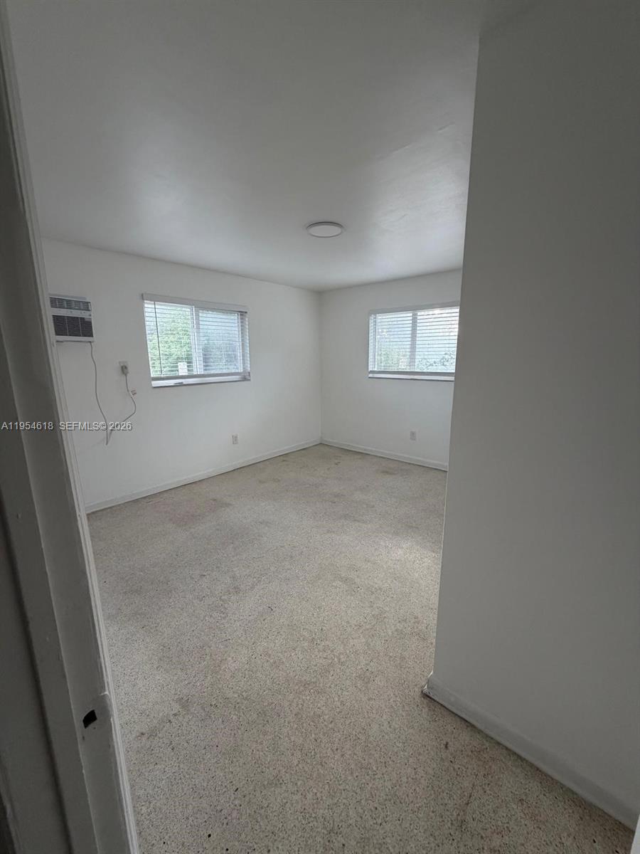 1608 Southwest 4th Street, Unit 9 Miami, FL 33135 - Photo 5 of 7 an empty room with windows and closet