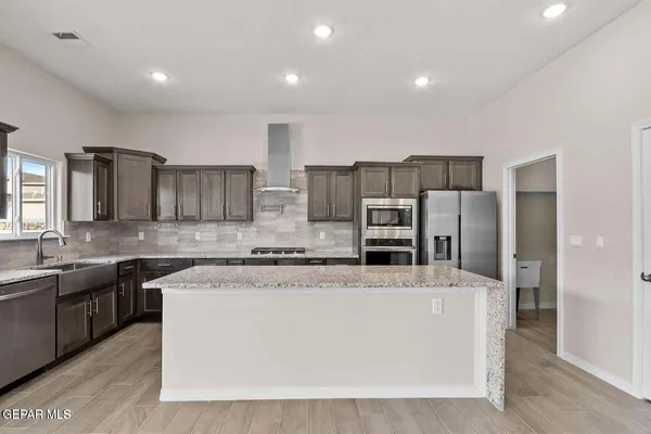 a kitchen with a sink and cabinets