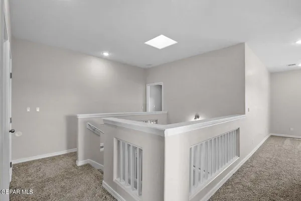a bathroom with a granite countertop sink and a large mirror
