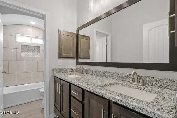 a bathroom with a bathtub and shower