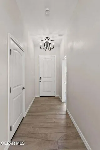 a bathroom with a granite countertop sink and a toilet