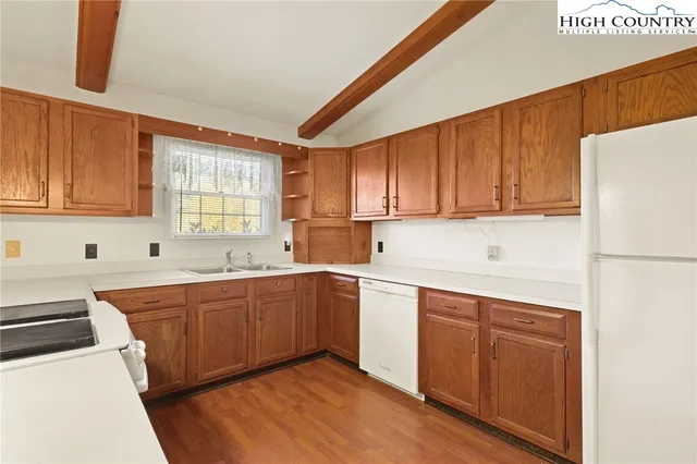 a kitchen with sink cabinets and window