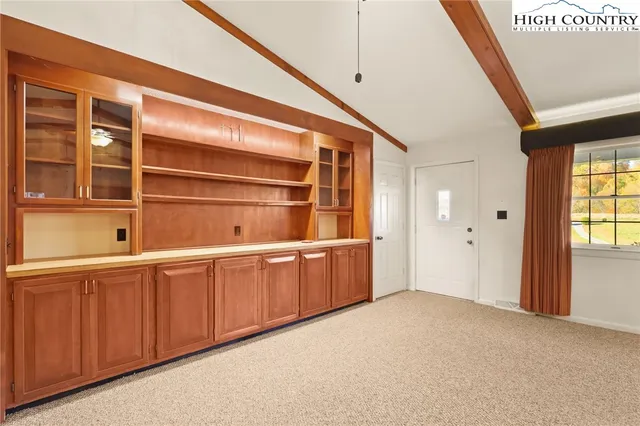 a room with window and cabinet