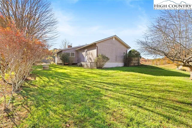 a view of a house with a big yard
