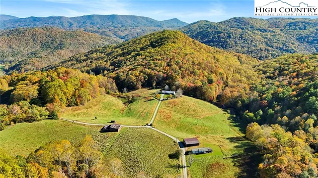 a view of a swimming pool with a yard