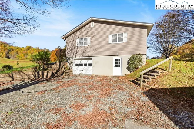 a view of a house with a snow on the road
