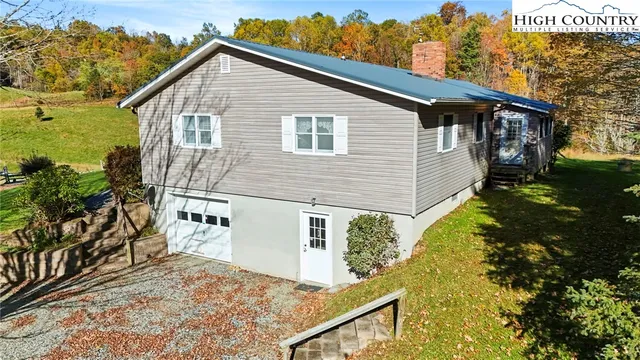a view of a house with wooden fence
