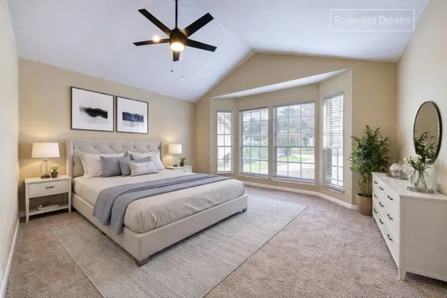 a spacious bedroom with a large bed and a large window