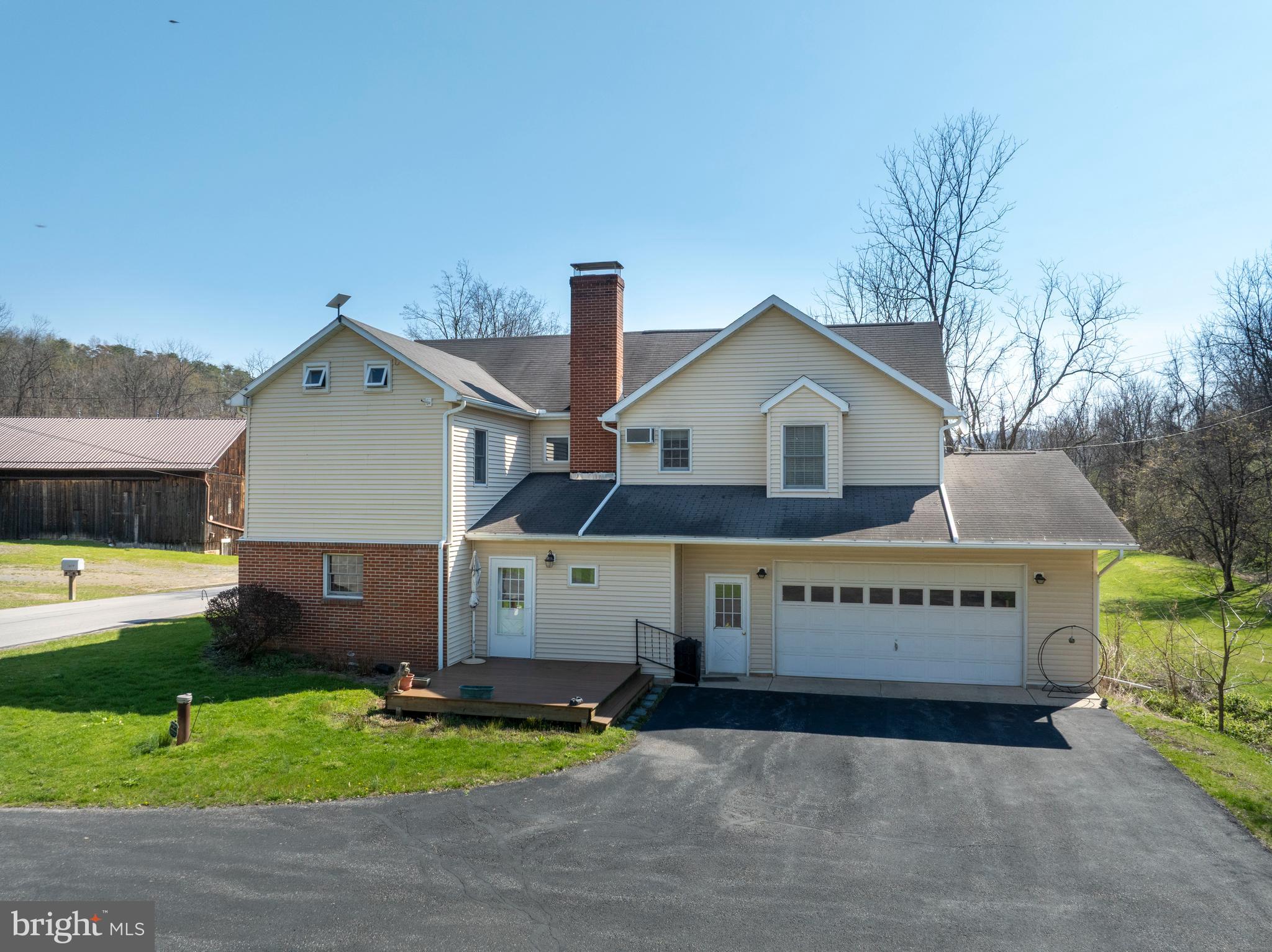 5859 Bethel Road Alexandria, PA 16611 - Photo 3 of 126 a view of a house with a yard and potted plants