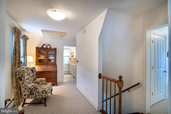 a view of staircase with white walls