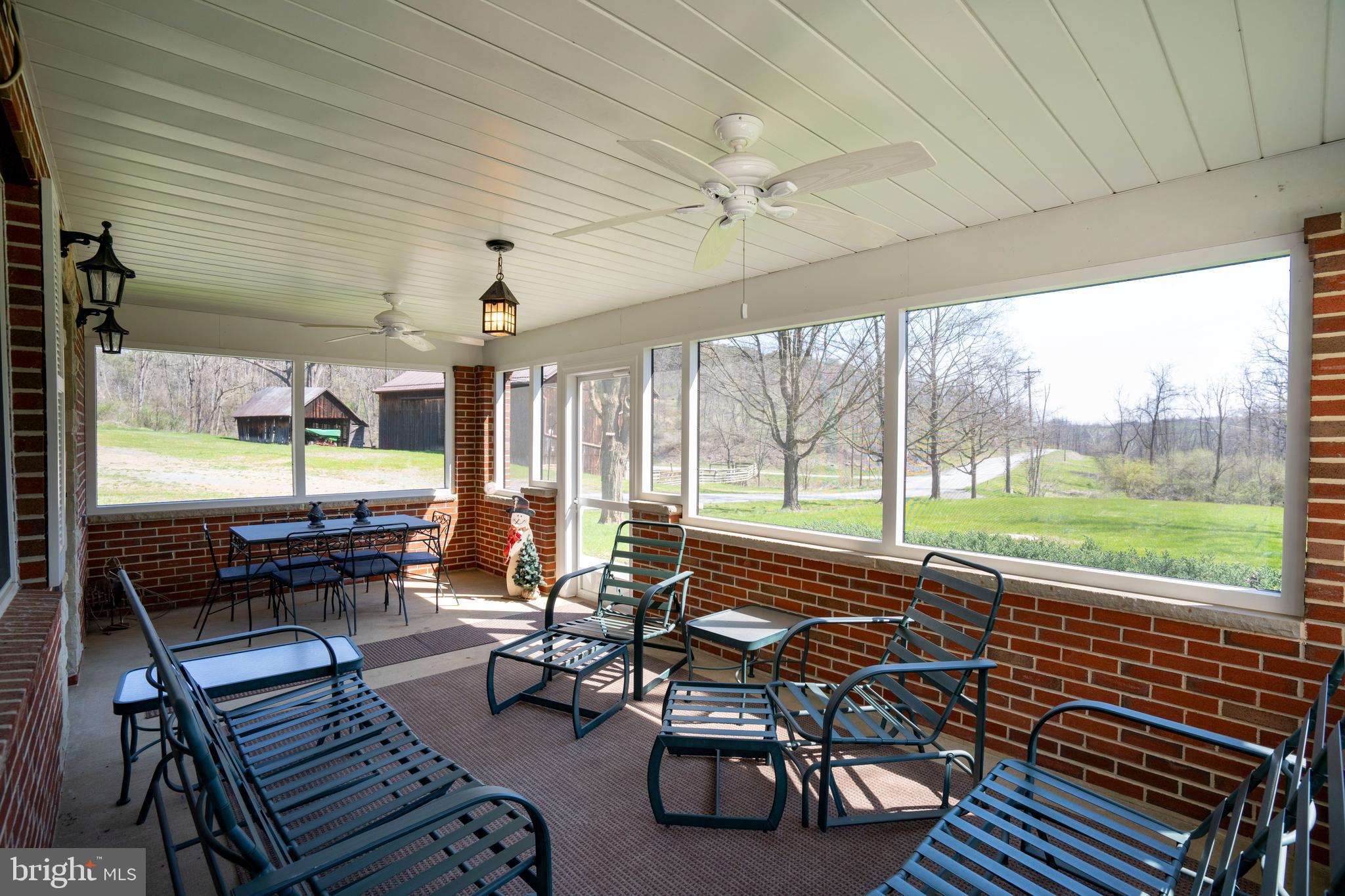 5859 Bethel Road Alexandria, PA 16611 - Photo 9 of 126 a building outdoor space with patio furniture and wooden floor