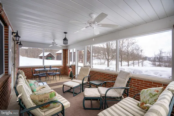 a view of a livingroom with furniture and window