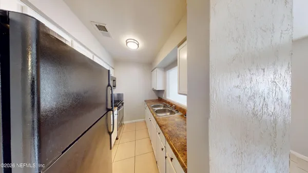 a view of hallway with wooden floor