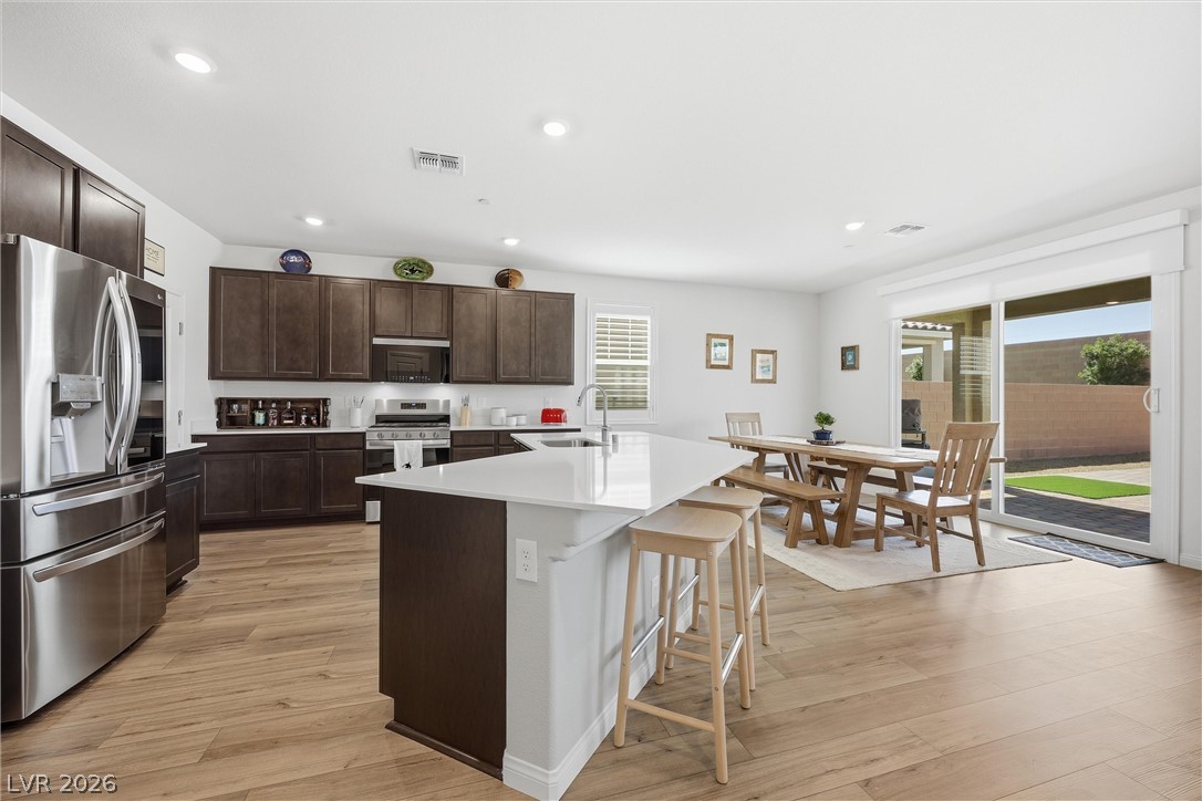 3705 Alla Rocca Avenue Henderson, NV 89044 - Photo 13 of 50 This bright kitchen and dining area features abundant natural light and seamless outdoor access.