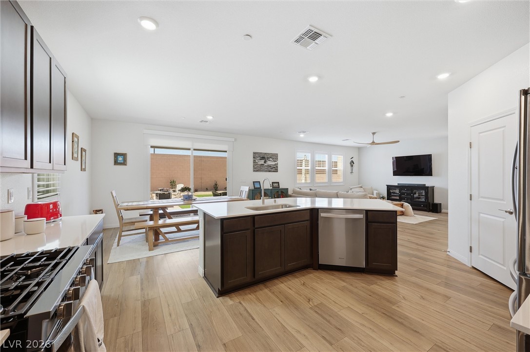 3705 Alla Rocca Avenue Henderson, NV 89044 - Photo 16 of 50 This spacious interior features an open-concept kitchen, dining area, and living room perfect for entertaining.