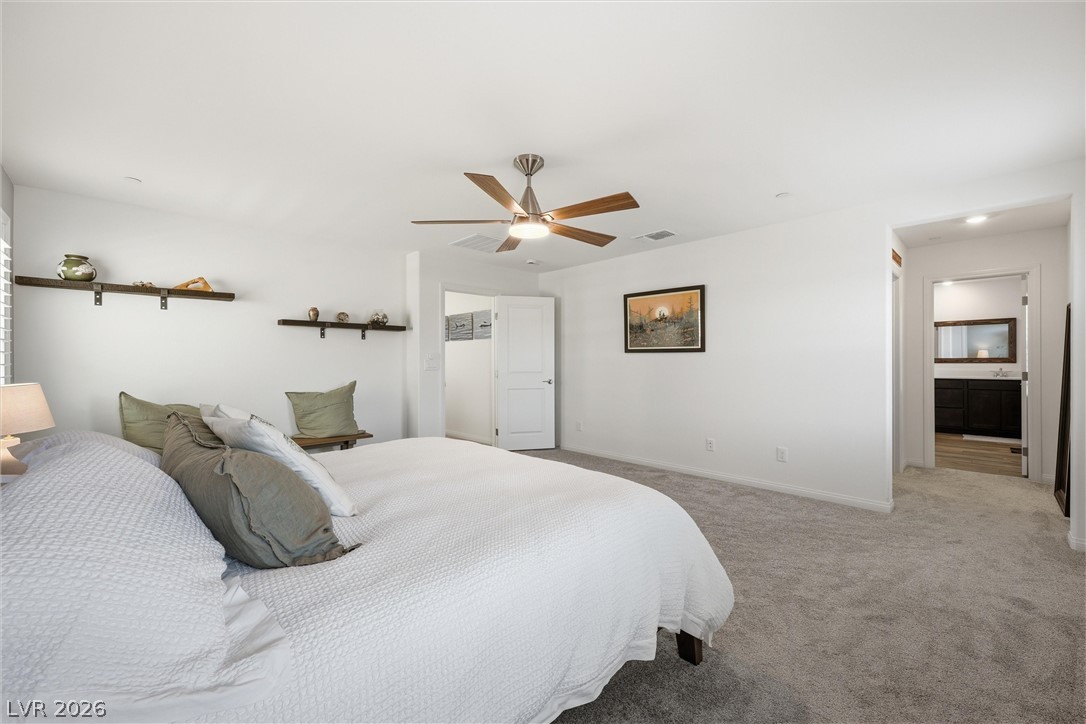 3705 Alla Rocca Avenue Henderson, NV 89044 - Photo 22 of 50 This tranquil sleeping space offers comfort and quietude with soft carpeting underfoot.