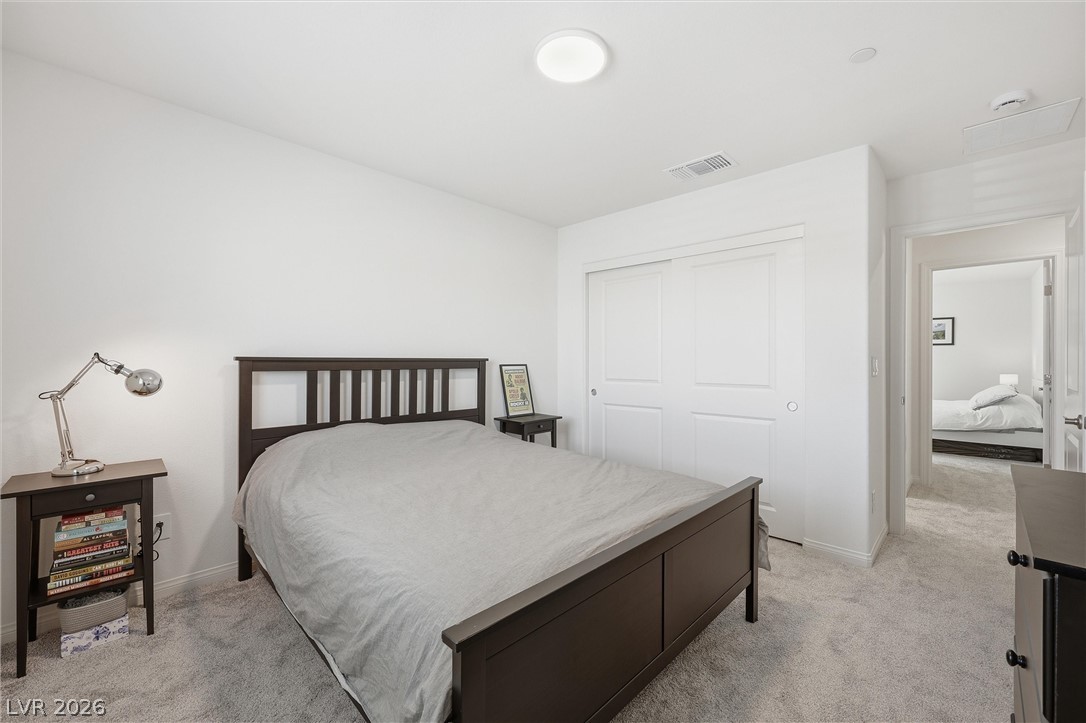 3705 Alla Rocca Avenue Henderson, NV 89044 - Photo 28 of 50 This spacious bedroom #4 offers comfortable living with soft carpet flooring and ample closet space.