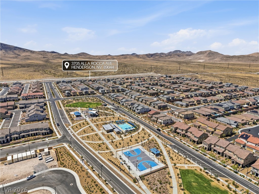 3705 Alla Rocca Avenue Henderson, NV 89044 - Photo 44 of 50 This elevated perspective captures the expansive community with recreational amenities and distant mountain views.
