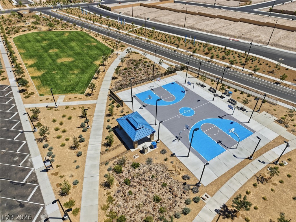 3705 Alla Rocca Avenue Henderson, NV 89044 - Photo 47 of 50 An aerial view captures the vibrant blue and gray basketball court alongside a lush green field.